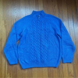 Blue cable knit turtleneck with pearl button detail